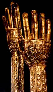 Chimú burial gloves of hammered gold with tattoo designs, 1200-1300 A.D. Collection of the Museo Oro del Perú. 