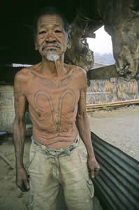A Khiamniungen Naga warrior from the Myanmar/India border with “tiger chest” tattoo.