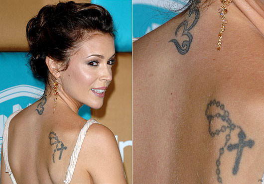 Alyssa Milano - Actress has a tattooed chain with a cross on her shoulder, 