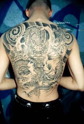 dragon back tattoo. sad angel tattoo. dragon back
