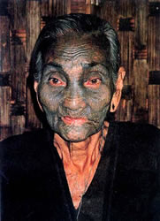 Heavily tattooed Ashö woman from Myanmar.