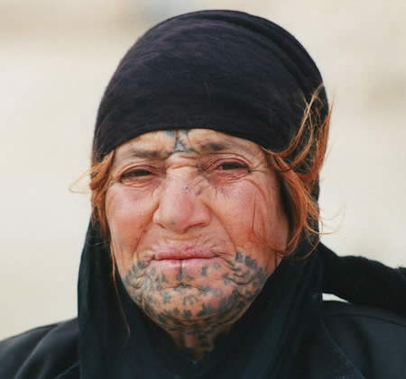 Modern day Bedouin woman with traditional facial tattoos