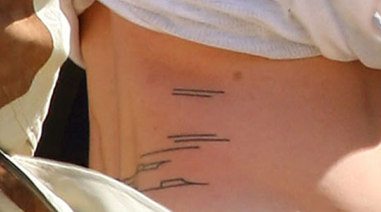 Close up of Brad Pitt's tattoo