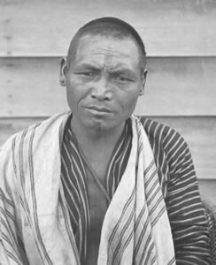 Atayal headhunters with chin and forehead markings, ca. 1900.