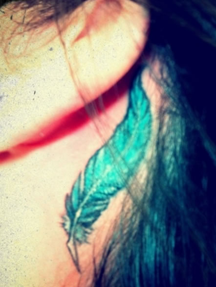 Demi Lovato feather tattoo