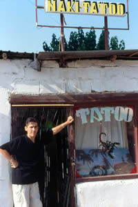 Naki outside of his tattoo shop in Prizren, Kosovo.