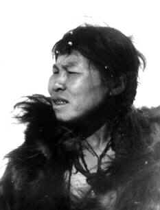 Tattooed Chukchi woman with fertility tattoo on cheek and tattoo-foil near mouth, 1901.