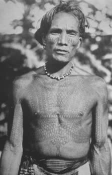 Kalinga bikking (chest tattoo), ca. 1900. This chief, as evident by his complex markings, took many a head. He is fortified in a tattooed skin of centipede scales (ufug).