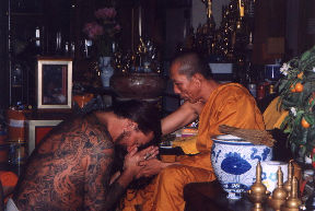 Thomas being blessed in ceremony