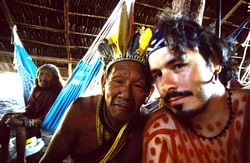 The author posing with Tiwit and his wife who were my house-hosts in Capivara village.